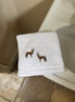 Embroidered face cloth featuring oryx design, 100% cotton