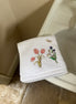 Embroidered face cloth featuring spring garden design, 100% cotton