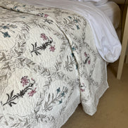 hand-block-printed-bedspread-pink-blue-flower-detail
